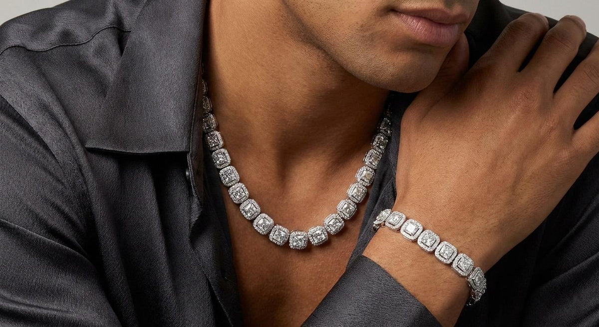 A diamond halo necklace and matching bracelet worn with a grey shirt