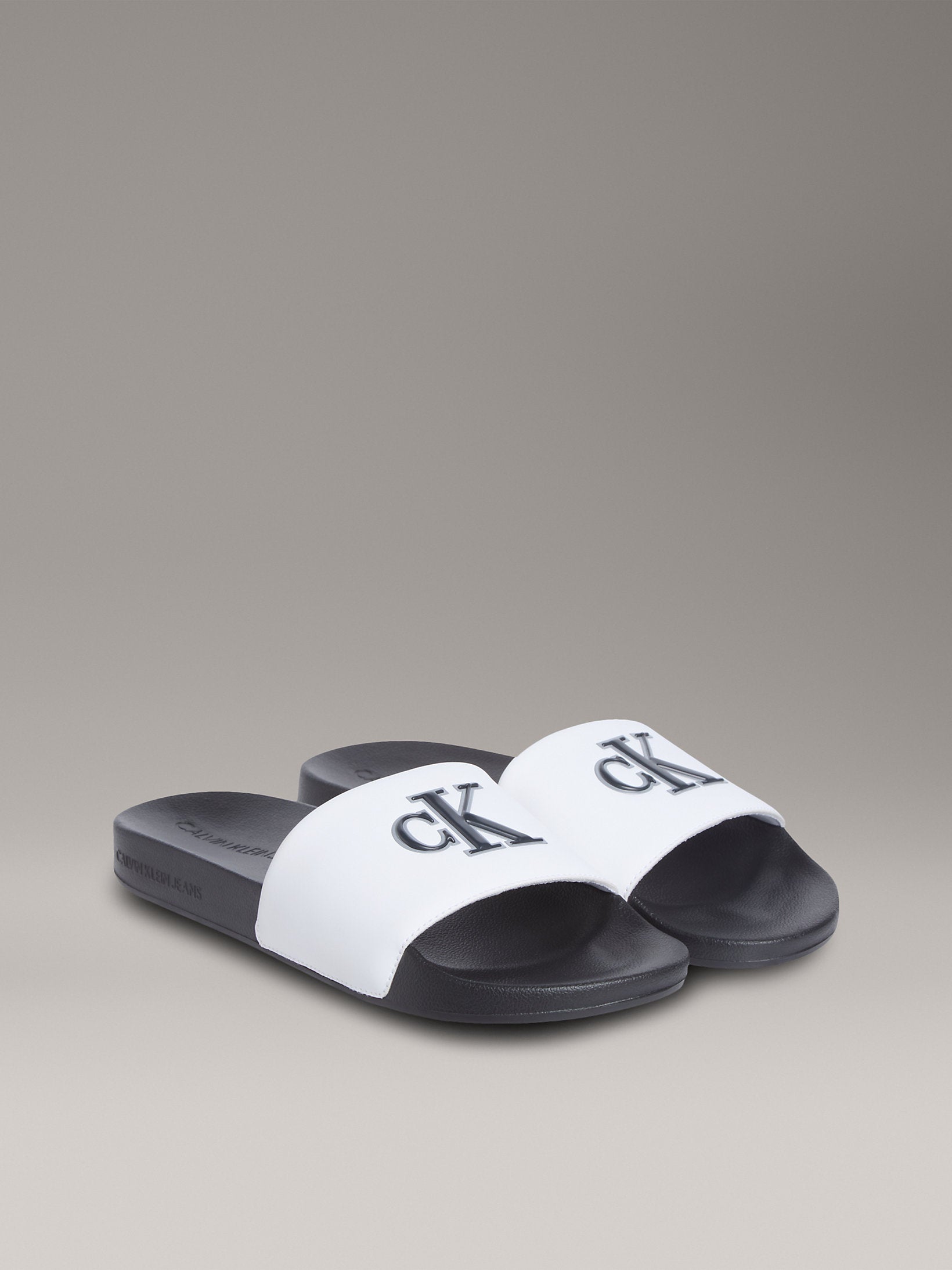 Calvin Klein Mens Jelly Mono Slides In Black and White